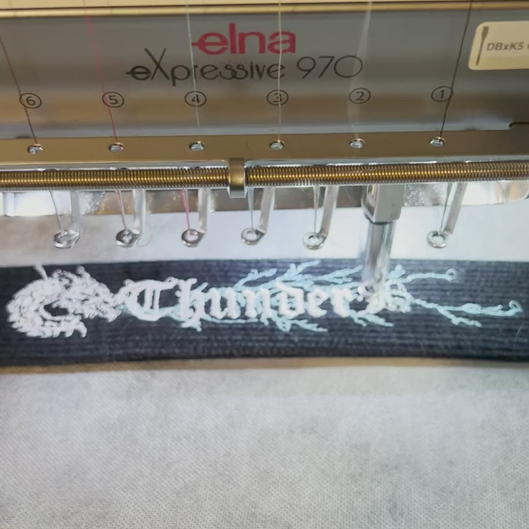 Load video: Embroidery machine sewing a belt